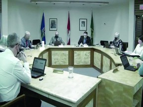 Vulcan Mayor Tom Grant, Town councillors and administrator Kim Fath wore masks during the Dec. 14 meeting, held in council chambers at the Town of Vulcan's office.