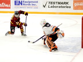 Timmins Rock forward Harry Clark fires a shot past Hearst Lumberjacks goalie Liam Oxner for what would prove to be the game-winning goal during Tuesday night’s NOJHL contest at the McIntyre Arena. Clark’s third goal of the season, late in the second period, put the Rock in front 3-0 in a game they would have to hang on to edge the Lumberjacks 3-2. THOMAS PERRY/THE DAILY PRESS