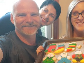 Dan and Joni White and their daughter Erin, with fresh-baked Christmas cookies. Handout