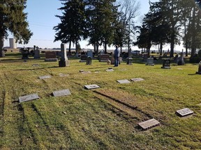 Shown are ruts that appear to be made by a vehicle’s tire, around several gravestones at Riverview Cemetery in November. Jim Martin photo