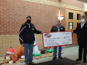 John Nooyen, AGRIS Co-operative board President and Jim Anderson, middle, AGRIS ownership committee chair, presents a donation to The Salvation Army’s Red Kettle Campaign. Captain Stephen Holland, Community Services Officer for the Salvation Army Chatham-Kent Ministries accepts the donation on behalf of The Salvation Army. The $10,000 donation will be dispersed equally across the Salvation Army zones that are located in AGRIS Co-operative’s trading area.