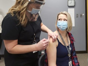 Registered nurse Kristen Davis is the first in Grande Prairie to receive the COVID vaccine on Dec. 23, 2020. Davis works in the ICU at the Queen Elizabeth II (QEII)  Hospital in Grande Prairie.
