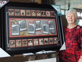 Auxiliary Treasurer Wilma Manary poses with the next print at the Kincardine Hospital, which is entitled "Legendary Buildings". Liz Nurton photo