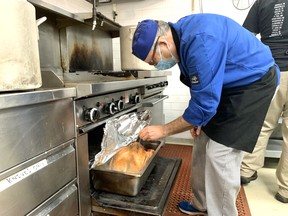 Chef Mohamed Jouar checks the internal temperature of one of the 37 turkeys being prepared for this year's Christmas Day Community dinner. 
Jennifer Hamilton-McCharles/The Nugget