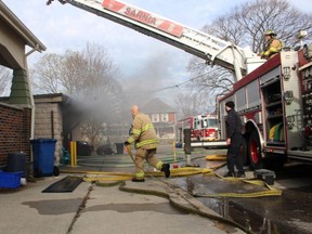 Sarnia firefighters are shown at the scene of a fire Wednesday on Stuart Street where city police said one person has died.