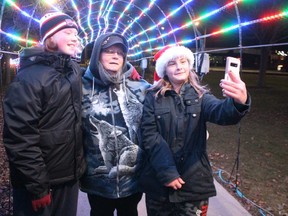 Donna St. Jean poses with grandchildren, Austin St. Jean, left, and Peyton McDermott, for a selfie during a visit to the Celebration of Lights in Sarnia's Centennial Park.