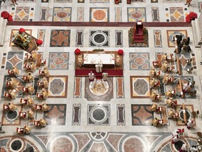 Pope Francis celebrates Christmas Eve mass with only a few faithful able to participate due to the coronavirus disease (COVID-19) regulations in order to stop a rise in infections, in St. Peter's Basilica at the Vatican, December 24, 2020. Vatican Media/ Handout via REUTERS THIS IMAGE HAS BEEN SUPPLIED BY A THIRD PARTY.     TPX IMAGES OF THE DAY