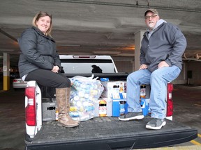 Tillsonburg Lions Club members, Kelly (left) and Blair Oatman, have already started collecting refundable cans and bottles for the Lions Club Bottle Drive, which happens Saturday, Jan. 2 in the parking lot behind Avondale United Church from 8 a.m. to noon. (Chris Abbott/Norfolk and Tillsonburg News)