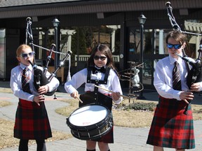 Sherwood Park's Macmillan siblings, Sage, Jasper, and Carson performed outside of the Sherwood Care Centre to bring joy to the senior residents inside on Tuesday, April 21. Lindsay Morey/News Staff