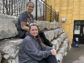 Justine McIsaac, consumption treatment co-ordinator at the Integrated Care Hub's Consumption and Treatment Services site, with Amber Lagroix, another community support worker, outside the site at 661 Montreal St. on Dec. 11.