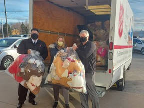 Lambton Ford president and general manager Rob Ravensberg (right) drops off a delivery of toys to the Salvation Army on Dec. 18. The toys were collected during this year’s Teddy Bear Toss. Handout/Sarnia This Week