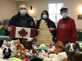 Brian Minty and his grandson Nathan Bishop presented a cheque in the amount of $1,300 to the Kincardine Food Bank. The money was raised from the sale of Canadian Flags and Trees that they made. SUBMITTED