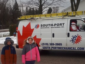 Levi and Emma were excited to see Santa pass by in the Christmas Convoy on Sunday, December 20. Hannah MacLeod/Kincardine News