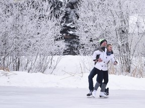 Jeremy Duke twirls his girlfriend Miriam Wattel while ice skating on Muskoseepi Pond at Muskoseepi Park on Monday December 26, 2016 in Grande Prairie, Alta.
