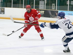 Ben Leeson/Postmedia Network

Soo Jr. Greyhounds defenceman Luca Spadafora looks to get control of the puck in Great North Under-18 League exhibition action on Saturday in Sudbury