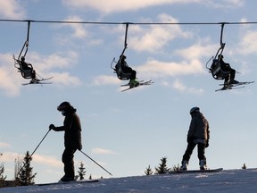 Skiers and snowboarders take to the slopes at Snow Valley Ski Club on a warm, sunny day in Edmonton, on Thursday, Dec. 10, 2020.