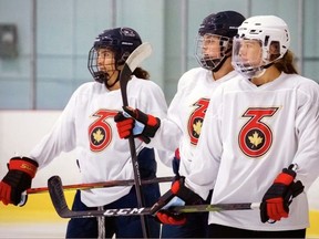 Burford's Emma Woods (right) and her Toronto Six teammates at a recent practice. The Six and the rest of the teams in the National Women's Hockey League will play their season starting next month.