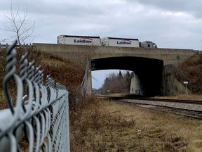 A tandem truck heads west on Highway 401 over the CNR overpass in Brockville on Thursday afternoon. (RONALD ZAJAC/The Recorder and Times)