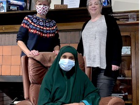 Nasro Mohamed, seated, a refugee from Somalia now living in Brockville, has been here alone for over a year as she awaits the chance to bring her husband and young daughter here from Uganda. She is getting help from Rev. Marianne Emig Carr, of First Presbyterian Church, left, and Jeanette Johnston of the sponsor group Brockville Freedom Connection. RONALD ZAJAC/The Recorder and Times