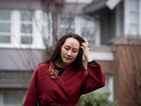 Meng Wanzhou, chief financial officer of Huawei, leaves her home to attend a hearing at B.C. Supreme Court, in Vancouver, on Friday, December 11, 2020. THE CANADIAN PRESS/Darryl Dyck ORG XMIT: VCRD102