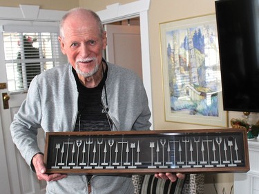 George Sims displays his favourite chess set, a 1962 Austin set, made of extruded aluminum that he bought at a Kinsmen Auction several years ago. Ellwood Shreve/Chatham Daily News/Postmedia Network