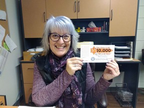 Agape Centre executive director Lisa Duprau with a ticket for the upcoming draw for $10,000.Handout/Cornwall Standard-Freeholder/Postmedia Network

Handout Not For Resale