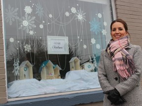 Katie Shillingford outside the office window she decorated at EXIT Realty Seaway in Cornwall. Photo Friday, December 4, 2020, in Cornwall, Ont. Todd Hambleton/Cornwall Standard-Freeholder/Postmedia Network