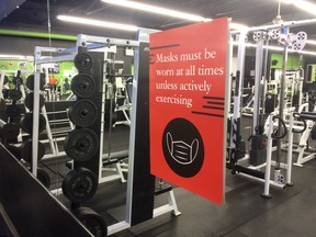 A sign on a mirror at a health club in Cornwall. Photo on Tuesday, December 8, 2020, in Cornwall, Ont. Todd Hambleton/Cornwall Standard-Freeholder/Postmedia Network