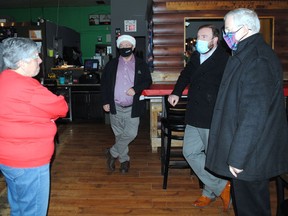 O'Neill's Pub owner Krista O'Neill speaks with South Stormont Deputy Mayor David Smith and Stormont-Dundas-South Glengarry MP Eric Duncan and MPP Jim McDonell during one of the stops made by the three politicians in South Stormont, on Saturday December 5, 2020 in Long Sault, Ont. Greg Peerenboom/Special to the Cornwall Standard-Freeholder/Postmedia Network