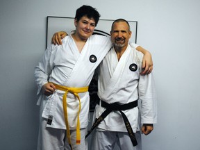 Handout/Cornwall Standard-Freeholder/Postmedia Network
Bryan Rennie, right, completed his black-belt exam in karate with Wattie Karate recently, with the help of son Cameron, left.

Handout Not For Resale