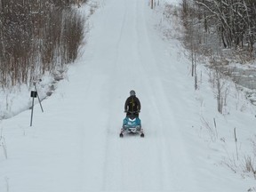 A snowmobiler travels along the rail trail on Owen Sound's east side on Tuesday, December 29, 2020.