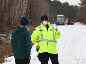 OPP officers investigate the discovery of a body on Tilton Lake Road.