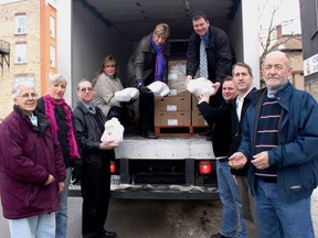 Many hands made light work as volunteers and donors unloaded 60 turkeys donated by the team from Bickerton Brokers Real Estate in Gananoque to the Food Bank at their location on King Street East in Gananoque back in 2010. L-r, Audrey Jackson, Whitney Kilgore, Bill Helmer, Judy Clark, Emily Bell, Mark Kellogg, Dave Redmond, Dwayne Fletcher and Cliff Weir. Lorraine Payette/For Postmedia Network