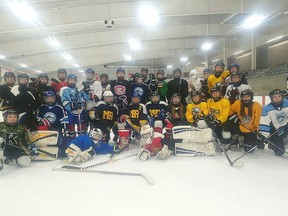 Students in Ecole secondaire catholique Marie-Rivier's hockey academy gather on the ice at the Invista Centre in Kingston during the 2019-20 school year prior to the arrival of the COVID-19 pandemic.