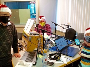 Retired Bayshore Broadcasting general manager Ross Kentner, left, with Country 93 morning hosts Shawn Turner and Julia Manina during the 81st annual CFOS-Sun Times Christmas Fund Broadcast Dec. 6 in Owen Sound. (Scott Dunn/The Sun Times/Postmedia Network)