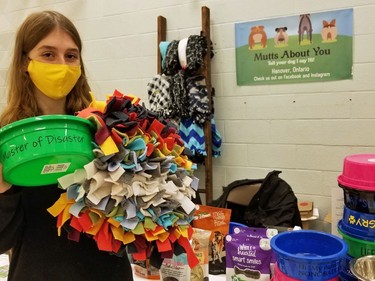 Hanover teen Olivia Schlosser with some items she hopes to sell under her new business, Mutts About You, at the Holiday Student Makers Market Saturday in the former Sydenham Community School building in Owen Sound. (Scott Dunn/The Sun Times/Postmedia Network)