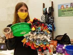 Hanover teen Olivia Schlosser with some items she hopes to sell under her new business, Mutts About You, at the Holiday Student Makers Market Saturday, Dec. 5, 2020 in the former Sydenham Community School building in Owen Sound, Ont. (Scott Dunn/The Sun Times/Postmedia Network)