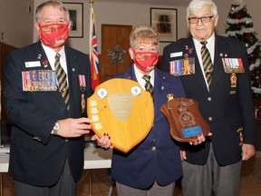 Liz Leblanc was named the Legionnaire of the Year at the annual honours and awards ceremony at the Pembroke Legion Nov. 28. She received the award from branch president Stan Halliday and honours and awards chairman Bob Handspiker (right).