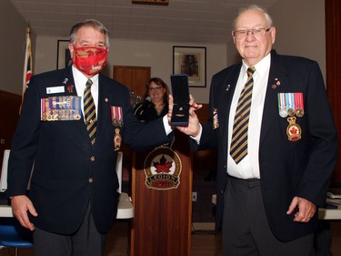 Ron Parker (right), a long-time ordinary member of the Pembroke Legion received his 60-year pin from branch president Stan Halliday during the honours and awards ceremony Nov. 28.