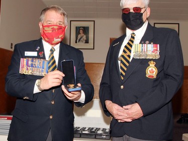 Darrell Rabb (right), a long-time ordinary member of the Pembroke Legion received his 50-year pin from branch president Stan Halliday during the honours and awards ceremony Nov. 28.