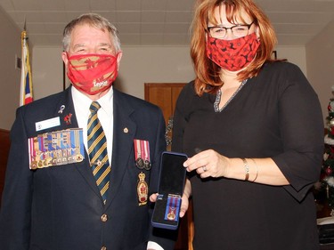 Nicole Handspiker-Adams, MC for the honours and awards ceremony at the Pembroke Legion Nov. 28 was surprised with a branch medal, which was presented by Branch 72 president Stan Halliday.