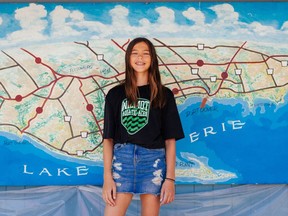 Julia Notebomer already earned her place in Lake Erie lore, and now the Stratford teen is part of a documentary photo exhibition that showcases Canadians' personal connections with the body of water that borders part of Ontario and four U.S. states. (Colin Boyd Shafer for Environmental Defence Canada)