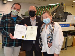 Sarnia-Lambton MPP Bob Bailey is pictured presenting a Small Businesses, Big Hearts award to Reid Campbell, left, and Joyce Keelan with Creative Education of Canada. The company pivoted to manufacturing COVID-19 masks for children amid the pandemic. (Handout)