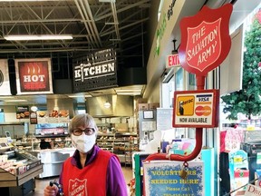 Darlene Dolezar from St. Albert recently volunteered at The Salvation Army Christmas Kettle at Save on Foods in Spruce Grove. The Christmas Kettle Campaign runs until Dec. 24. To volunteer with The Salvation Army's Christmas Kettle Campaign, contact them at (780) 458-1937. Photo by Kristine Jean