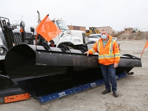 Rick Henderson, manager of operations for southeast and citywide for the City of Greater Sudbury, stands near some of the city's winter fleet in Sudbury, Ont. on Dec. 3.
