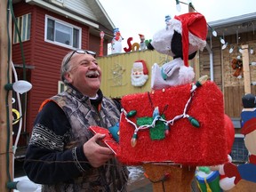 Mike Skakoon sets up his outdoor Christmas decorations and lights at his home in the Donovan in Sudbury, Ont. on Friday December 4, 2020. His father, Nick, started the tradition in 1958, and Mike and his son have continued the decorating tradition. John Lappa/Sudbury Star/Postmedia Network