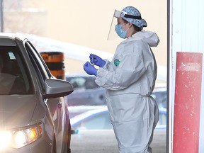 Community members get tested at the drive-thru COVID-19 Assessment Centre on Regent Street in late 2020. PCR swabs are now being restricted to those who work or live in high-risk settings.