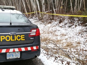 Police tape marks the area where a body was discovered off Tilton Lake Road in Eden Township.