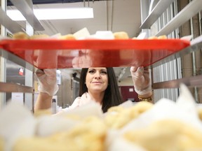 Katie Johnson, of Lougheed Funeral Home, volunteers at the Elgin Street Mission in Sudbury, Ont. on Wednesday December 19, 2018. The Rotary Club of Sudbury Sunrisers co-ordinate a yearly campaign in December to support the Elgin Street Mission to attract new volunteers and to raise much needed cash donations.