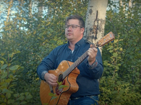 A screenshot of Cory Huber performing "Rudy's Song," which he wrote after a program partnering local artists with seniors introduced him to local senior Rudy Loy.